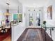 Bright and airy entryway with a view into the dining room at 7917 Broadmoor Pines Blvd, Sarasota, FL 34243