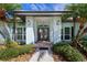 Inviting front entrance with double doors and decorative lighting at 7917 Broadmoor Pines Blvd, Sarasota, FL 34243