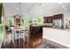 Open concept kitchen with island, granite countertops and breakfast area at 7917 Broadmoor Pines Blvd, Sarasota, FL 34243
