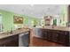 Spacious kitchen with island, granite countertops, and view to Gathering room at 7917 Broadmoor Pines Blvd, Sarasota, FL 34243