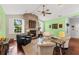 Living room with stone fireplace and hardwood floors at 7917 Broadmoor Pines Blvd, Sarasota, FL 34243