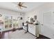 Bright office space with built-in cabinetry and a view to the backyard at 7917 Broadmoor Pines Blvd, Sarasota, FL 34243