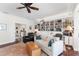 Home office with built-in bookshelves and hardwood floors at 7917 Broadmoor Pines Blvd, Sarasota, FL 34243