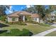 One-story home with attractive landscaping and a two-car garage at 8128 Collingwood Ct, University Park, FL 34201