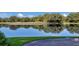 Scenic pond reflects trees and sky at the golf course at 8128 Collingwood Ct, University Park, FL 34201