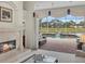 Living room with fireplace and stunning pool view at 8128 Collingwood Ct, University Park, FL 34201