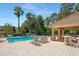 Community pool with patio and lounge chairs at 8277 Villa Grande Ct, Sarasota, FL 34243
