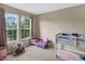 Bedroom with full and twin beds, window, and carpet at 8277 Villa Grande Ct, Sarasota, FL 34243