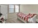 Bedroom with twin bed, carpet, and two windows at 8277 Villa Grande Ct, Sarasota, FL 34243