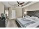 Main bedroom with a large bed and access to the bathroom at 8277 Villa Grande Ct, Sarasota, FL 34243