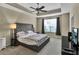 Large bedroom with tufted headboard and carpeted floors at 8277 Villa Grande Ct, Sarasota, FL 34243