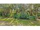 Lush backyard landscape with mature trees and abundant greenery at 9506 Royal Calcutta Pl, Lakewood Ranch, FL 34202