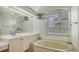 Bathroom boasts a relaxing soaking tub and updated vanity at 9506 Royal Calcutta Pl, Lakewood Ranch, FL 34202