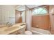 Clean bathroom with tub, shower, and updated vanity at 9506 Royal Calcutta Pl, Lakewood Ranch, FL 34202