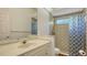 Simple bathroom with shower and updated vanity at 9506 Royal Calcutta Pl, Lakewood Ranch, FL 34202