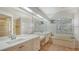 Elegant bathroom with double vanity, soaking tub, and shower at 9506 Royal Calcutta Pl, Lakewood Ranch, FL 34202