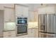 Stainless steel appliances and granite countertops highlight this well-equipped kitchen at 9506 Royal Calcutta Pl, Lakewood Ranch, FL 34202
