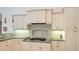 Bright kitchen boasts granite countertops, white cabinets, and stainless steel appliances at 9506 Royal Calcutta Pl, Lakewood Ranch, FL 34202
