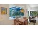 Bright breakfast nook with pool view, adjacent to Gathering room at 9506 Royal Calcutta Pl, Lakewood Ranch, FL 34202