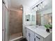 Modern bathroom with a large shower and quartz countertop at 1010 Tidewater Shores Loop # 201, Bradenton, FL 34208