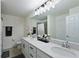 Bathroom features double sinks, quartz countertop, large mirror, and neutral tones at 1010 Tidewater Shores Loop # 201, Bradenton, FL 34208