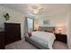 Bedroom with Queen bed and dark wood furniture at 1010 Tidewater Shores Loop # 201, Bradenton, FL 34208