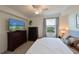 Comfortable main bedroom with large TV and water views at 1010 Tidewater Shores Loop # 201, Bradenton, FL 34208