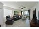 Spacious living room with leather furniture and water views at 1010 Tidewater Shores Loop # 201, Bradenton, FL 34208