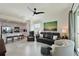 Living room is open to the kitchen with modern furniture at 1010 Tidewater Shores Loop # 201, Bradenton, FL 34208