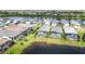 Aerial view showcasing lakefront homes with private pools and lush landscaping at 10180 Canaveral Cir, Sarasota, FL 34241