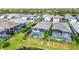 Aerial view showcasing multiple homes with private pools and screened enclosures at 10180 Canaveral Cir, Sarasota, FL 34241