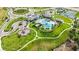 Community features resort-style pool, playground, and tennis courts at 10180 Canaveral Cir, Sarasota, FL 34241