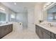 Luxurious bathroom with dual vanities and a large shower at 10180 Canaveral Cir, Sarasota, FL 34241