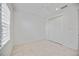 Well-lit bedroom with double door closet and window with shutters at 10180 Canaveral Cir, Sarasota, FL 34241