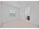 Cozy bedroom with ensuite bathroom and window with shutters at 10180 Canaveral Cir, Sarasota, FL 34241
