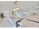 Elegant dining area with a contemporary table and chairs, and access to a patio at 10180 Canaveral Cir, Sarasota, FL 34241