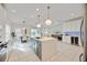 Spacious kitchen with island, stainless steel appliances, and white cabinets at 10180 Canaveral Cir, Sarasota, FL 34241