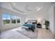 Spacious main bedroom with large window and ensuite bathroom at 10180 Canaveral Cir, Sarasota, FL 34241