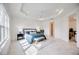 Spacious main bedroom with a large bed, plenty of natural light, and en suite bathroom at 10180 Canaveral Cir, Sarasota, FL 34241
