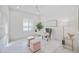 Bright home office with desk, chair, and natural light at 10180 Canaveral Cir, Sarasota, FL 34241