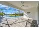Relaxing screened pool and patio area overlooking a lake at 10180 Canaveral Cir, Sarasota, FL 34241