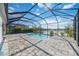 Enjoy this relaxing screened pool and patio area overlooking a lake at 10180 Canaveral Cir, Sarasota, FL 34241