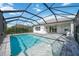 Relaxing pool and patio with covered cage at 10180 Canaveral Cir, Sarasota, FL 34241