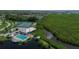 Aerial view of community amenities including tennis courts and pools at 1256 Spoonbill Landings Cir, Bradenton, FL 34209