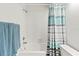 Clean bathroom with a shower/tub combo and striped shower curtain at 1256 Spoonbill Landings Cir, Bradenton, FL 34209