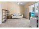 Cozy bedroom with a comfortable sofa and built-in shelving at 1256 Spoonbill Landings Cir, Bradenton, FL 34209