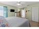 Spacious bedroom with a king-size bed and a view of the bathroom at 1256 Spoonbill Landings Cir, Bradenton, FL 34209