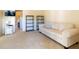 Secondary bedroom with a comfortable sofa and built-in shelving at 1256 Spoonbill Landings Cir, Bradenton, FL 34209