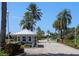 Gated entrance to the community with lush landscaping and guard house at 1256 Spoonbill Landings Cir, Bradenton, FL 34209