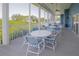 Screened-in community patio with tables and chairs at 1256 Spoonbill Landings Cir, Bradenton, FL 34209
